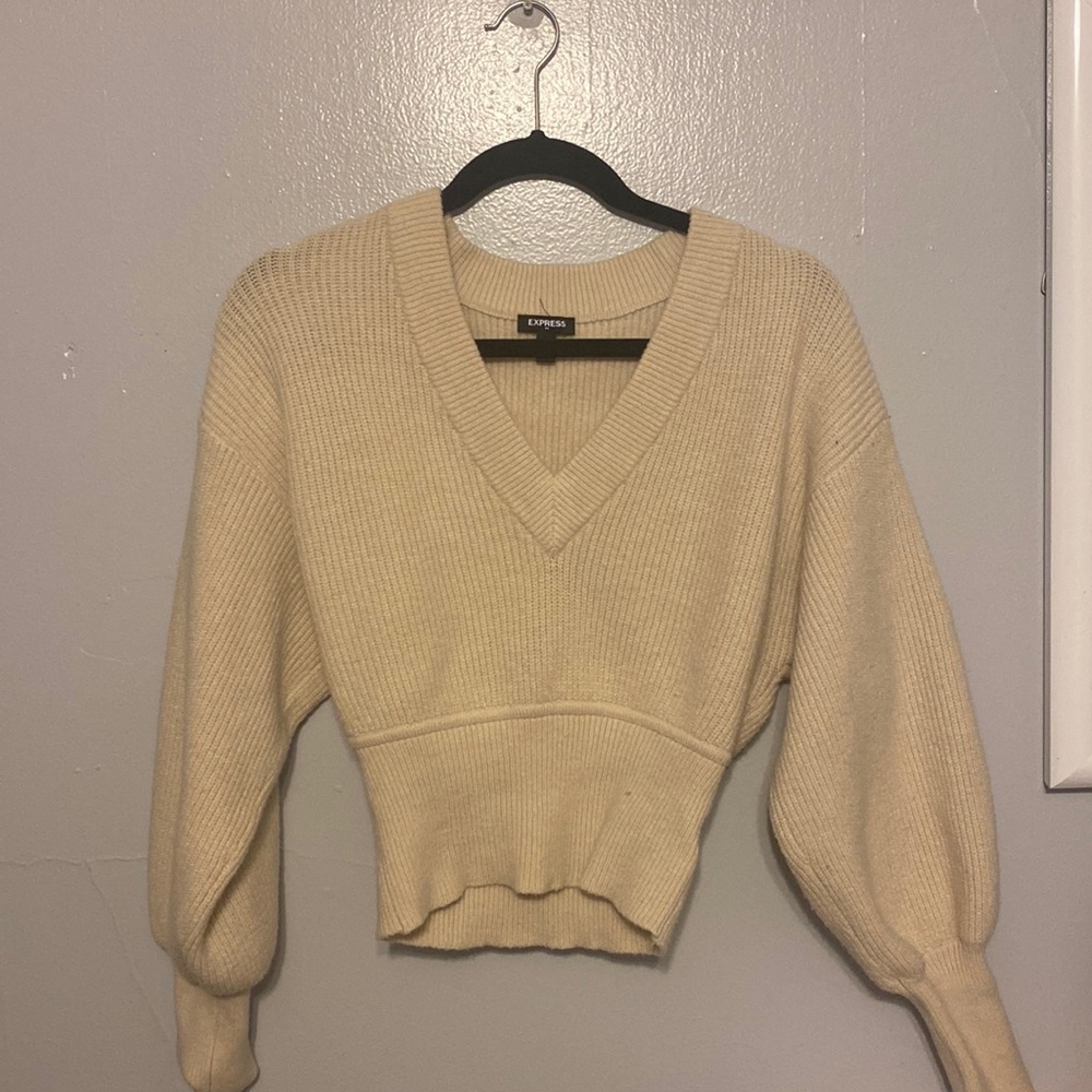 A cream-colored sweater by Express in a size small:))